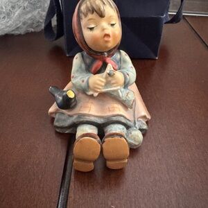 Charming Figurine with Red and Blue Accents